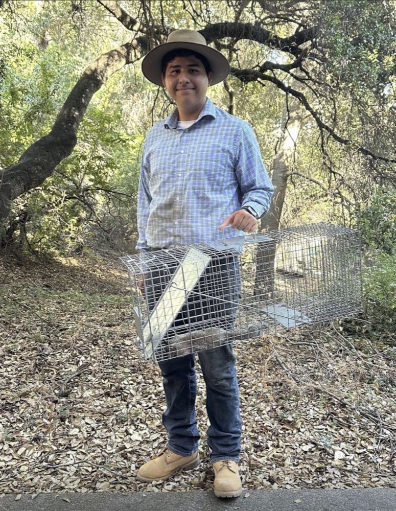 Armando Cisneros, founder of Cisneros Rodent & Wildlife Control, holding a live trap